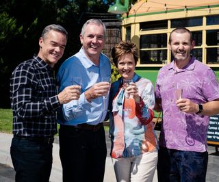 The cast of Neighbours raise a glass
