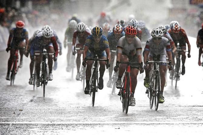 In a driving rainstorm, Ina-Yoko Teutenberg takes the field sprint for 4th place at the 2012 Olympic Games road race in London