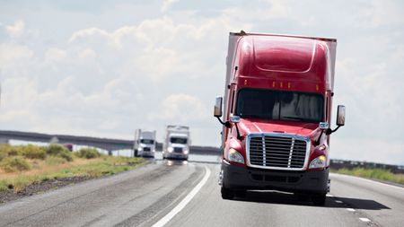 picture of trucks on a highway