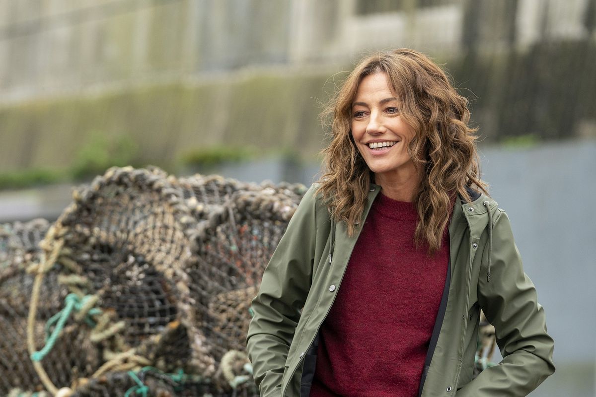 Orla Brady by a harbour as Kate Ryan in The South Westerlies