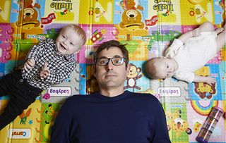 Louis Theroux with two babies for his new BBC2 doc Mothers on the Edge