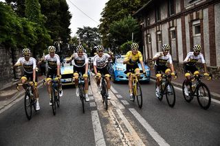Team Sky enjoy a celebratory glass of champagne during stage 21 at the Tour de France