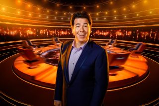 Michael McIntyre poses in front of The Wheel in the studio
