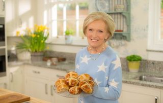 Mary with a plate of hot cross buns