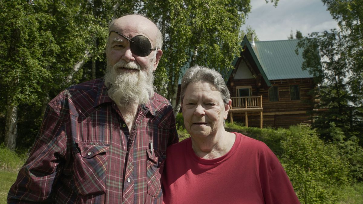 Duane and Rena in front of their home