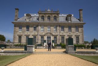 George Clarke stands outside the main house at Kingston Lacy in george clarke's national trust unlocked