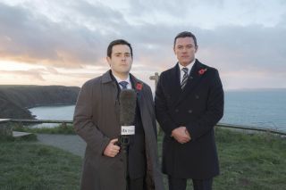 DCS Steve Wilkins and newsreader Jonathan Hill film an appeal on the Pembrokeshire coastal path