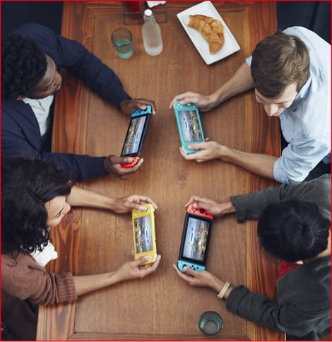 People playing Nintendo Switch each with their own console
