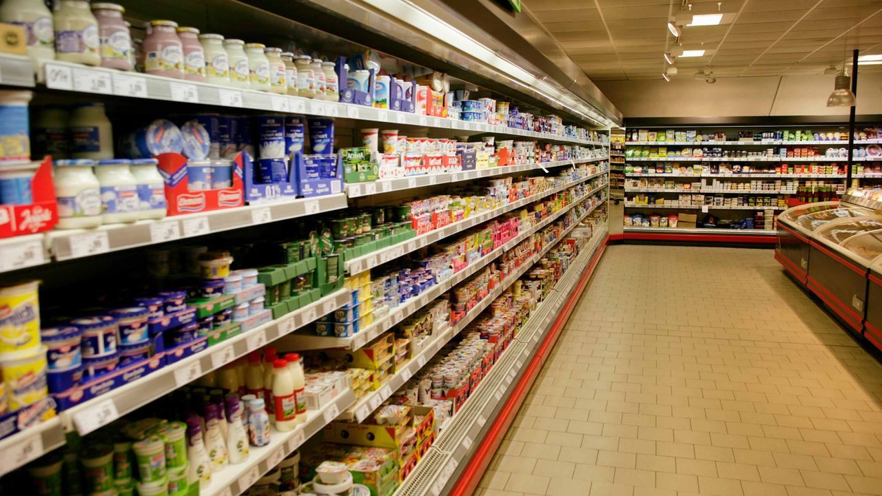 A blurred image of grocery store shelves