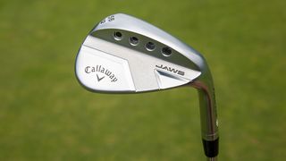 Callaway Jaws Full Toe wedge held aloft to reveal its stainless steel head
