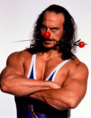 Wolf from Gladiators posing in the 1990s for Comic Relief