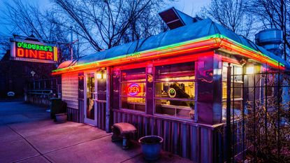 Photo of the outside of a diner at night