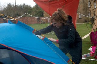 Laurel rescues Dottie from a burning tent in Emmerdale