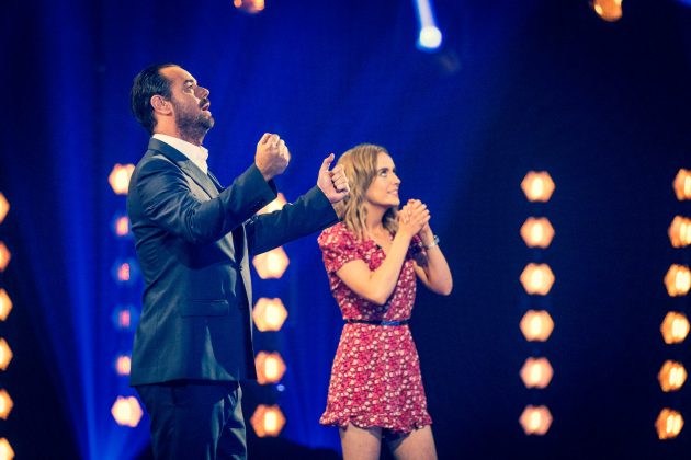 In it to win it: Danny offers this week's contestant Paula moral support. Can she beat The Wall?