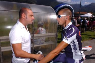 Riccardo Chiarini (De Rosa) speaks with Paolo Bettini after the finish