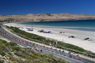 The Tour Down Under peloton rides through Aldinga Beach during stage 6