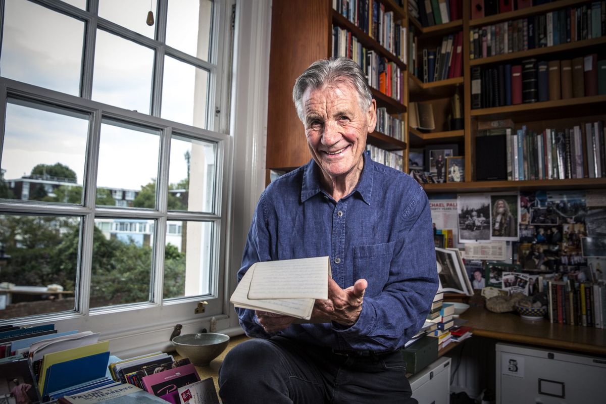 Michael Palin looks through his notes from his travels