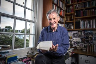 Michael Palin looks through his notes from his travels