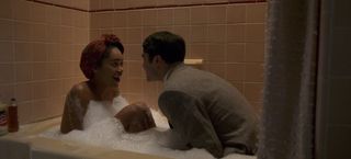 Laura Harrier and Darren Criss in the bath