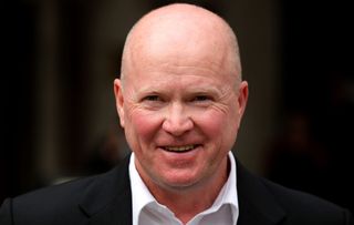 Steve McFadden posing for photographers. 