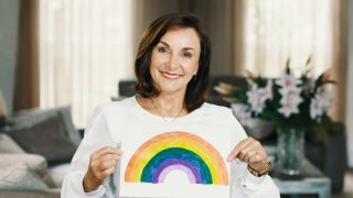 Shirley Ballas holding up a drawing of a rainbow on Dear NHS Superstars