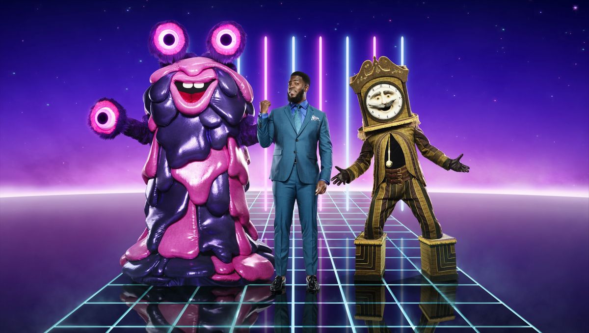 The Masked Singer Mo Gilligan poses alongside Masked Singers Blob and Grandfather Clock