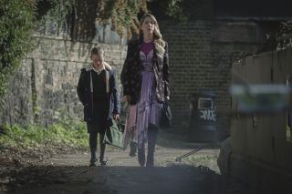 Kate Byrne as Olive and Katherine Ryan as Katherine walking down the street in The Duchess