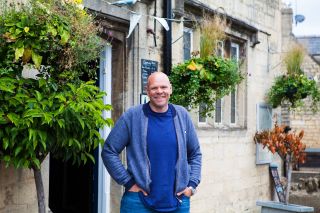 Tom Kerridge standing outside The Prince Albert in Stroud