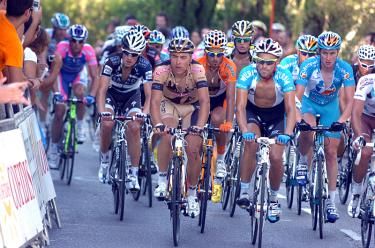 Racers cruise along, with hands atop bars.