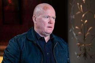 Phil wants Mick to sign the paperwork in EastEnders