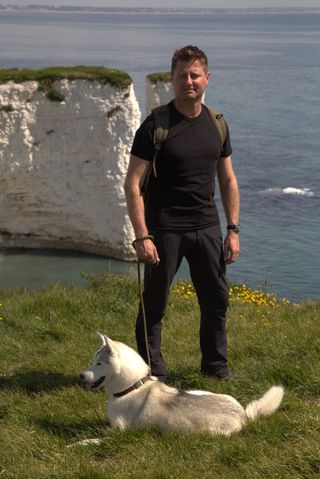George and his dog Loki at Studland Bay in Dorset