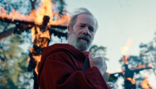 Peter Mullan in character as Father Carden